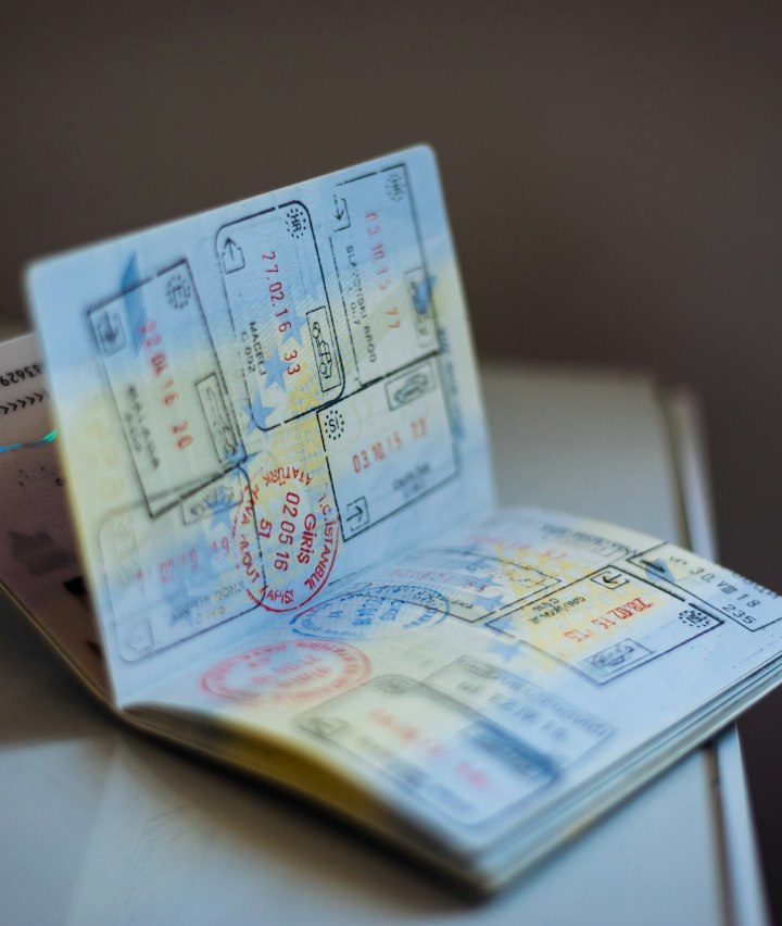 Open passport with immigration stamps